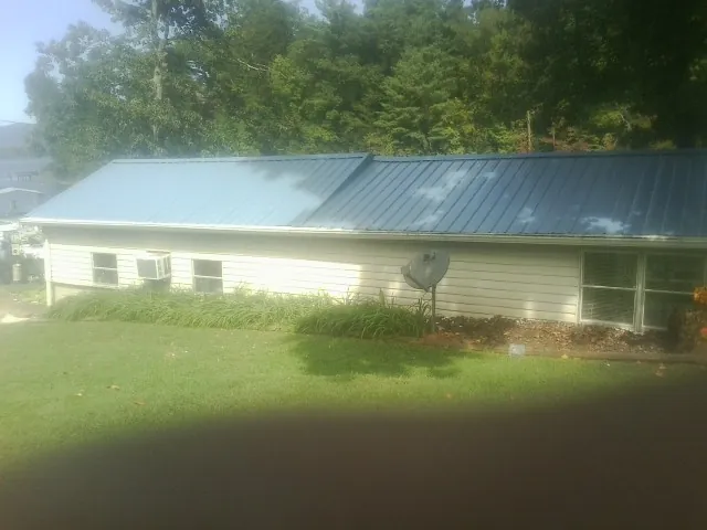 Blue metal roof running the length of a single story home in Gordonville